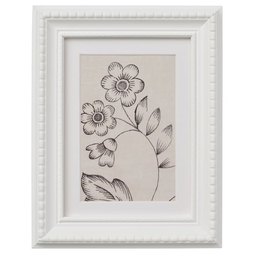 This describes a white framed picture with a black-and-white floral design.
