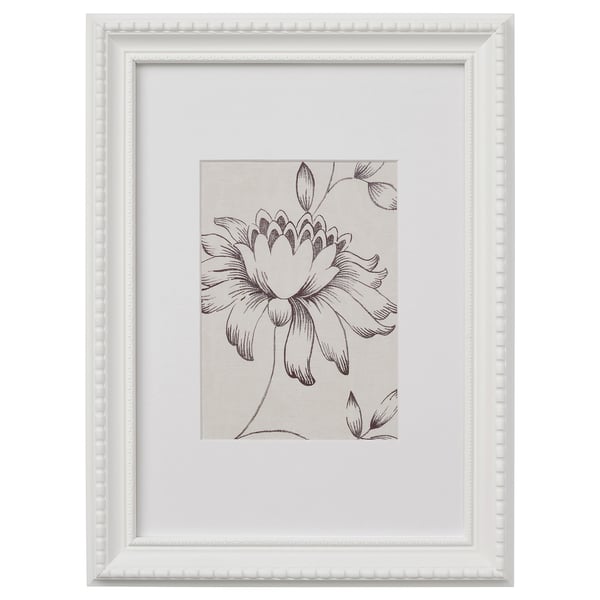 A white, beaded-edged picture frame containing a black and white drawing of a large flower with petals and leaves.