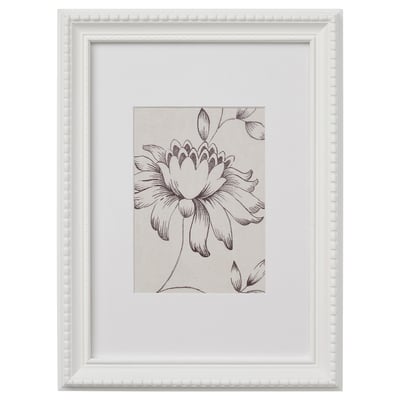 A white, beaded-edged picture frame containing a black and white drawing of a large flower with petals and leaves.