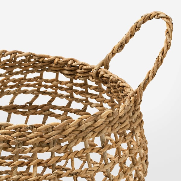 Handwoven banana basket with sturdy handles, showcasing natural fibres and quality craftsmanship.