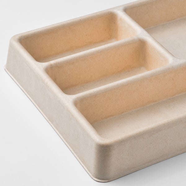 Small beige organiser with four compartments. Made from moulded paper pulp. Ideal for desk or drawer use.