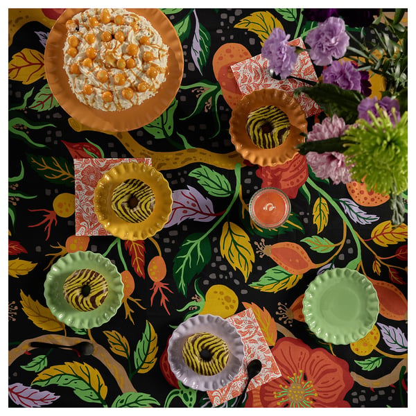 Vibrant autumn tablecloth with colourful floral patterns, protects table, fits 4-6 people.