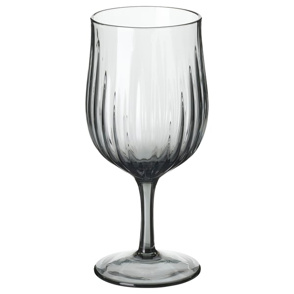 Single, grey, flute wine glass with vertical grooves, elegant shape, clear base. HÖSTAGILLE collection.