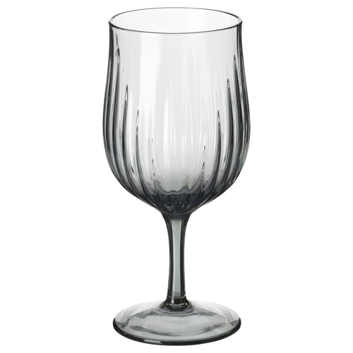 Single, grey, flute wine glass with vertical grooves, elegant shape, clear base. HÖSTAGILLE collection.
