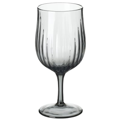Single, grey, flute wine glass with vertical grooves, elegant shape, clear base. HÖSTAGILLE collection.