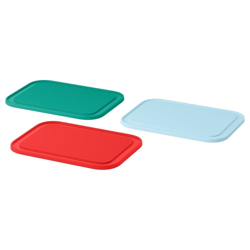 Three colourful rectangular plastic lids: green, red, blue; stackable design; used as lids or cutting boards.
