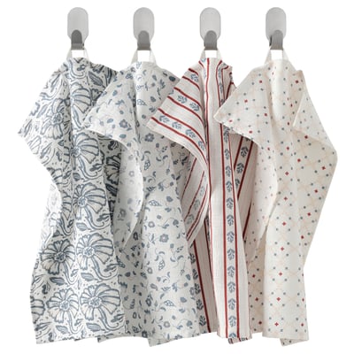 Four white towels with blue/red patterns hang neatly, featuring unique designs. Cotton, looped for easy hanging.