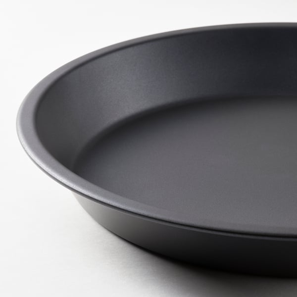 Round, dark-gray non-stick baking dish. Smooth, even surface for perfect dessert baking.