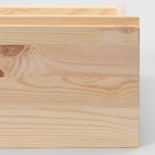 Close-up of smooth, light-colored wooden surface, showcasing natural grain patterns and polished finish.