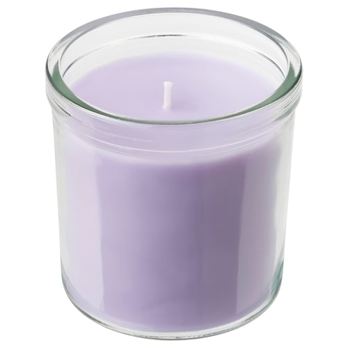 JÄMNMOD: lavender-scented candle in clear glass jar with smooth purple wax, cylindrical shape.