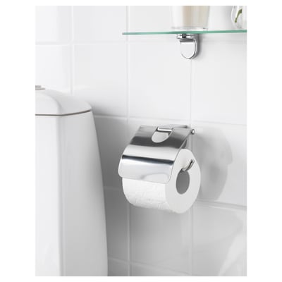 Modern chrome tp holder on white tiles with glass shelf