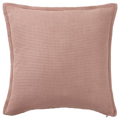 A square KLOTSTARR cushion cover in pale pink, made from beetroot residue. The texture is waffled, and it a zip for easy washing.