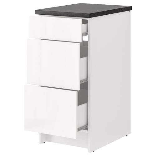 White KNOXHULT modular kitchen cabinet with three drawers and dark grey countertop.