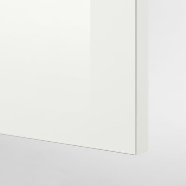 Clean, white, modular kitchen drawer detail; smooth surface, modern design.