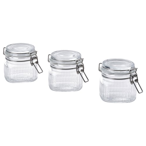 Three clear glass jars with silver lids and hinges, square-shaped, designed for storing food or small items.