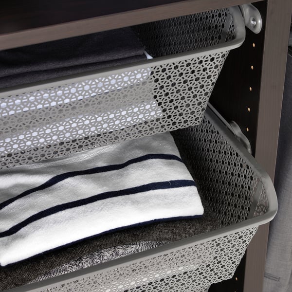 A metal wardrobe basket holding folded clothes, enhancing air circulation and organisation.