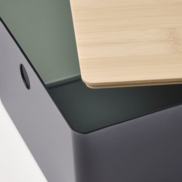 Close-up of a stackable storage box with a bamboo lid, showcasing sleek, modern design.