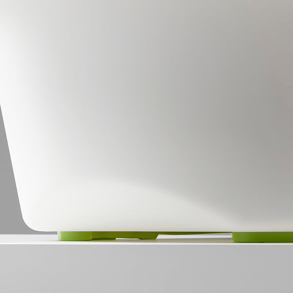 A close-up of a baby baths edge, highlighting its smooth, safe design with green slide protectors for stability.