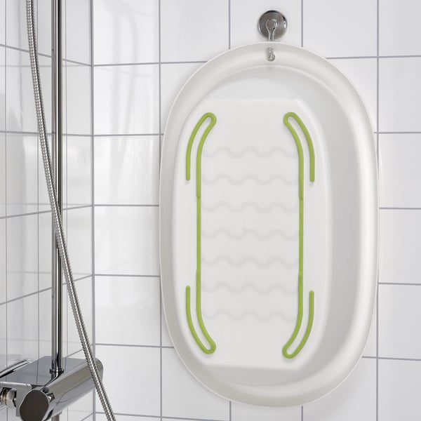 White baby bath hangs on shower wall, soft edges, anti-slip bottom.
