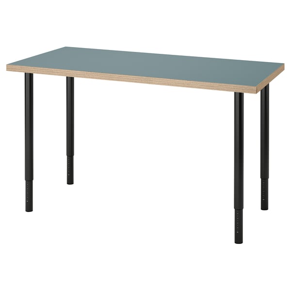 A LAGKAPTEN desk with a blue top and black adjustable legs. Rectangular shape with a modern design.