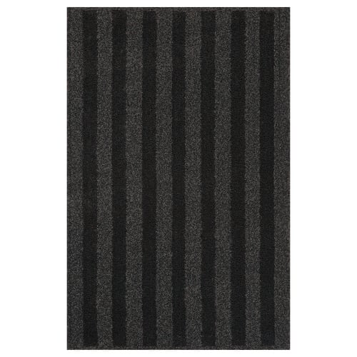 A dark grey LANDSVÄG rug with vertical stripes, featuring a soft, low pile texture.