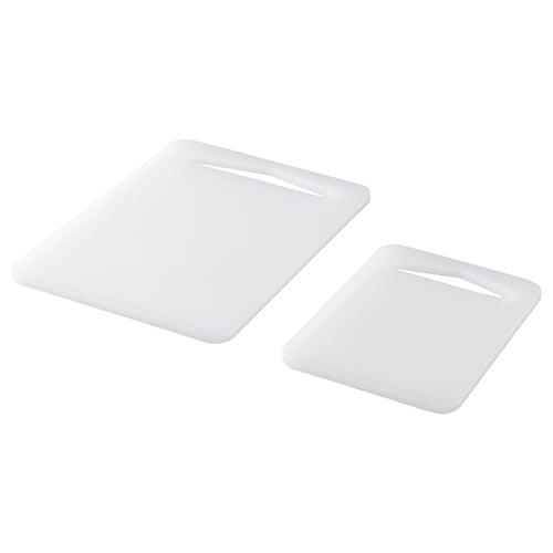 Two white rectangular plastic cutting boards, simple design.