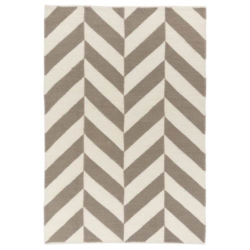 Beige and grey chevron-patterned wool rug with cotton backing.