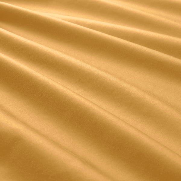 Golden yellow duvet cover set, smooth and lustrous, sateen-woven with cotton and lyocell blend.