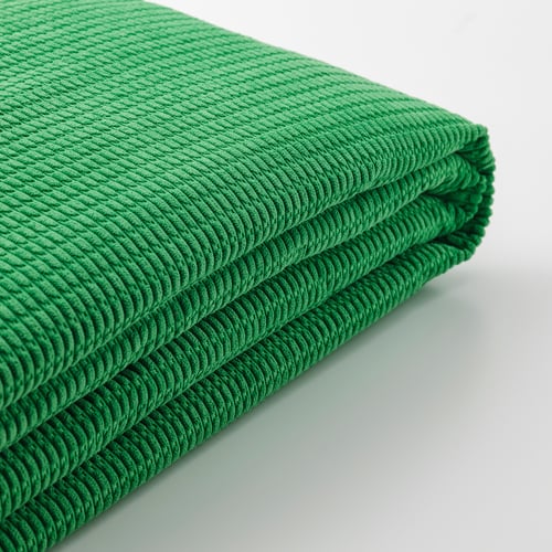 Thick green folded blanket, soft, recycled polyester.