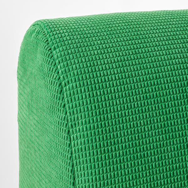 Bright green knitted fabric close-up, showcasing soft, textured lines and quality craftsmanship.