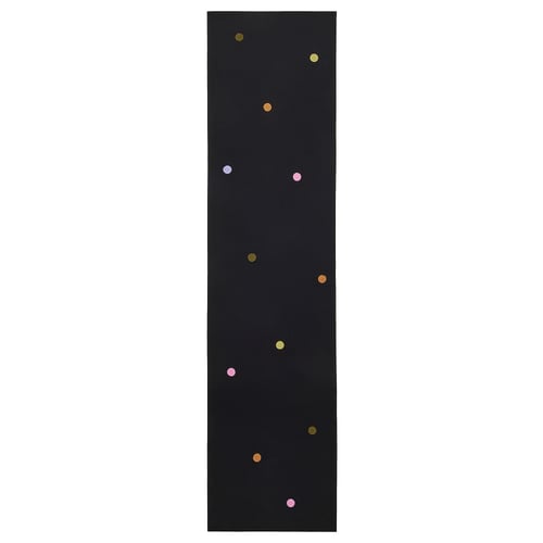A black IKEA MÄVINN cotton runner with multicoloured crochet dots.