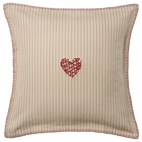 The MÄVINN pillow is beige with red, featuring a red embroidered heart, narrow stripes, and edge stitching. Made of 100% cotton.