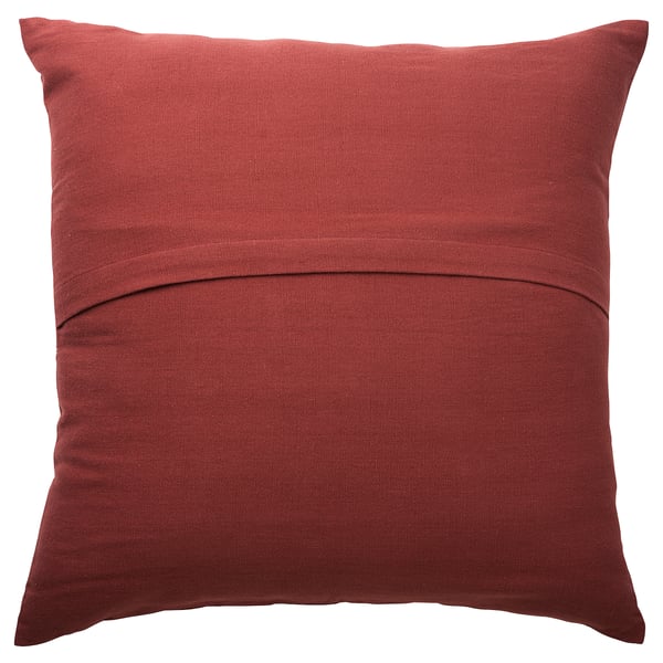 A red square pillow with subtle stripes and hand-embroidered designs, made from 100% cotton.