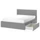 A grey MALM bed with a clean, minimalist design, featuring a high headboard and two large storage drawers on casters.