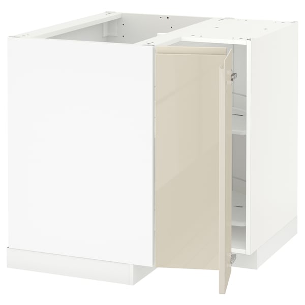 White modern kitchen cabinet set in high gloss beige with integrated handles; l-shaped design, metallic hinges.