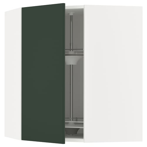 Image shows a corner kitchen cabinet in dark green with an open glass carousel.