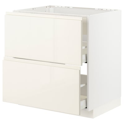 METOD kitchen unit in glossy beige with integrated handles and smooth drawers.