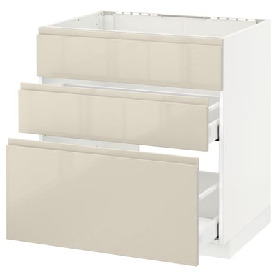 An IKEA METOD kitchen cabinet in beige with three drawers and a high gloss finish.