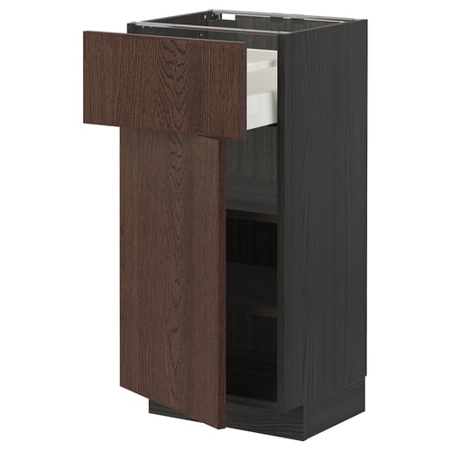 Dark brown kitchen cabinet with open drawer. Made of particleboard, oak veneer, and steel. A pull-out shelf and smooth drawer.