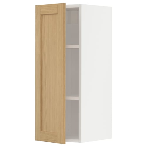 A white METOD kitchen cabinet with a light oak door, featuring a simple, rectangular design and bevelled edges.
