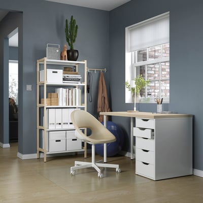 Home office setup with MITTCIRKEL desk, white chair, storage shelves, and window.