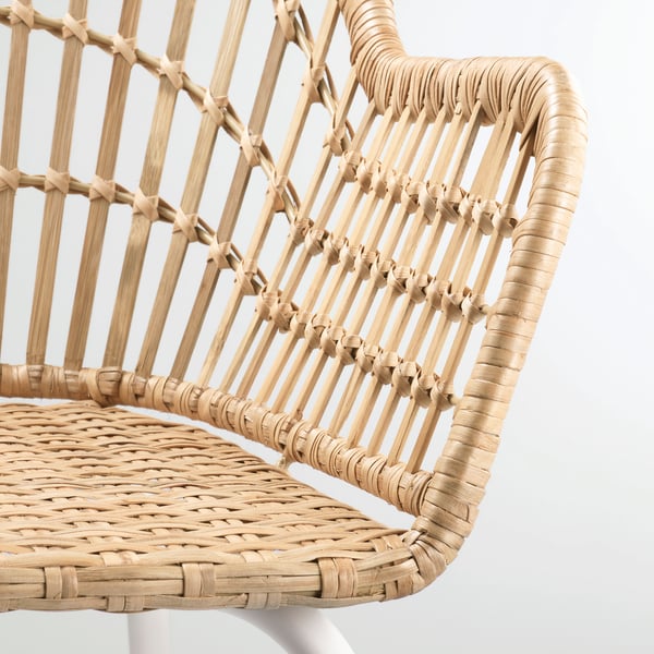Handwoven rattan and bamboo armchair, detailed weave, sturdy construction.