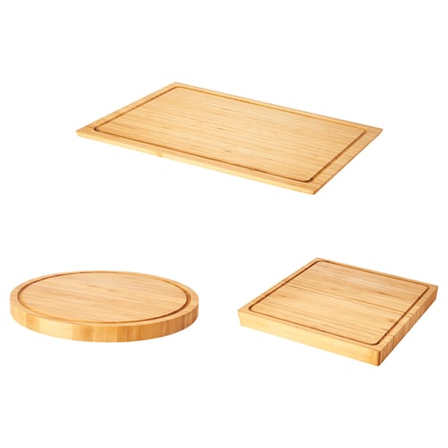 Three OLEBY bamboo chopping boards in rectangular and circular shapes, light brown colour, arranged neatly on a white background.