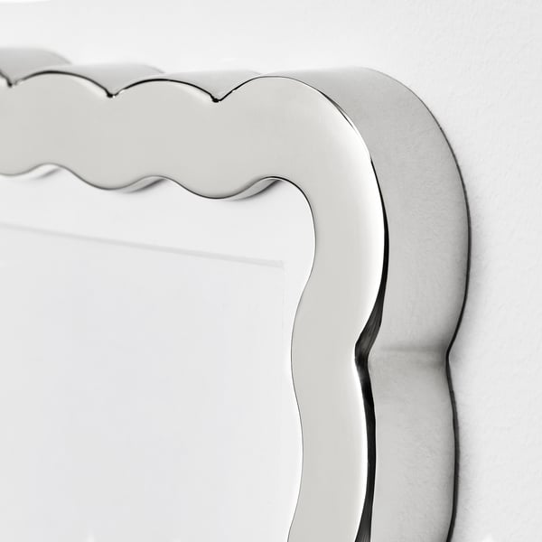 Black and white close-up of sleek, modern picture frames scalloped edge, showing high-quality finish.