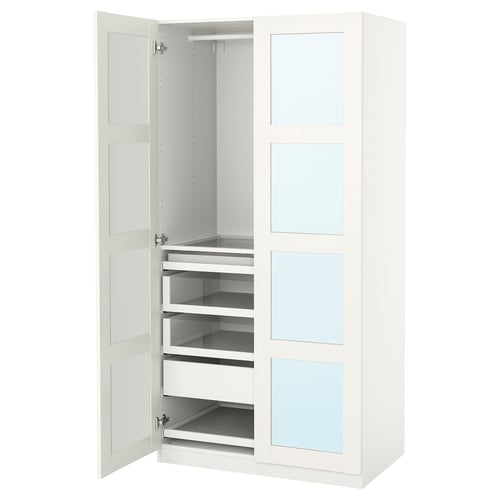 A white ikea PAX wardrobe with pull-out drawers, open to display storage compartments.