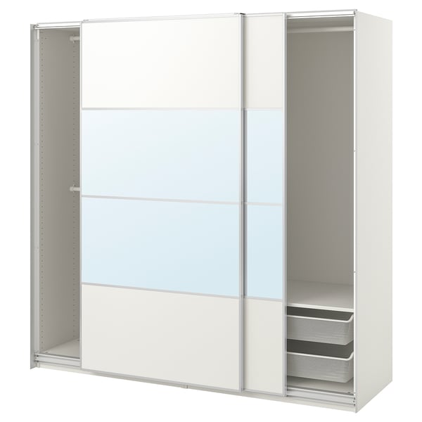 A white PAX wardrobe with sliding glass doors and mesh baskets. The modern design adjustable feet and minimalist, handle-less doors.