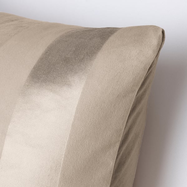 Close-up of beige striped cushion cover, showcasing quality fabric with contrasting textures.
