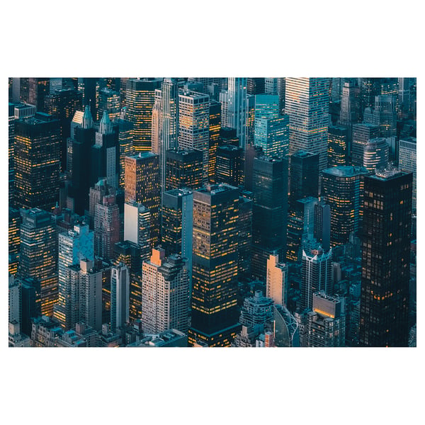 Aerial cityscape poster at dusk. Tall buildings with numerous lights, reflecting urban life. Dark blue tone, rectangular shape.
