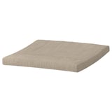 An ikea POÄNG footstool cushion, beige, square-shaped, with a textured cover and edge stitching.