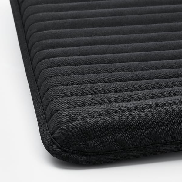Close-up of POÄNG footstool cushion. Shows its textured design and high-quality, recycled fabric.